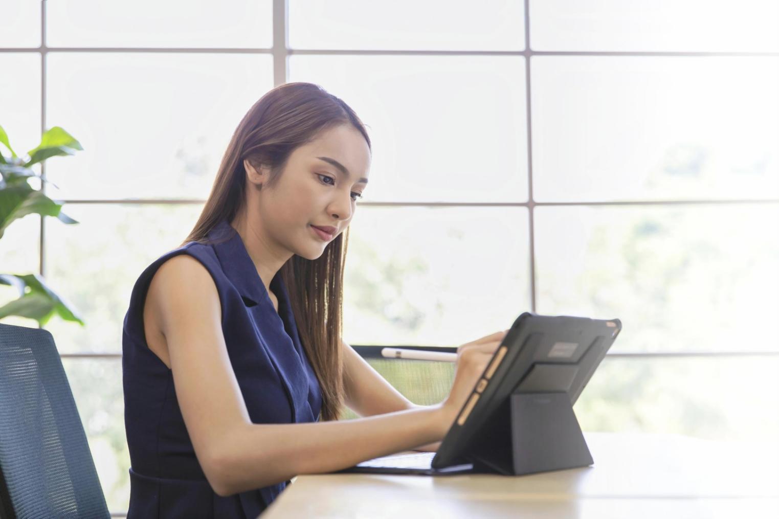 Financial planning workspace with documents and laptop